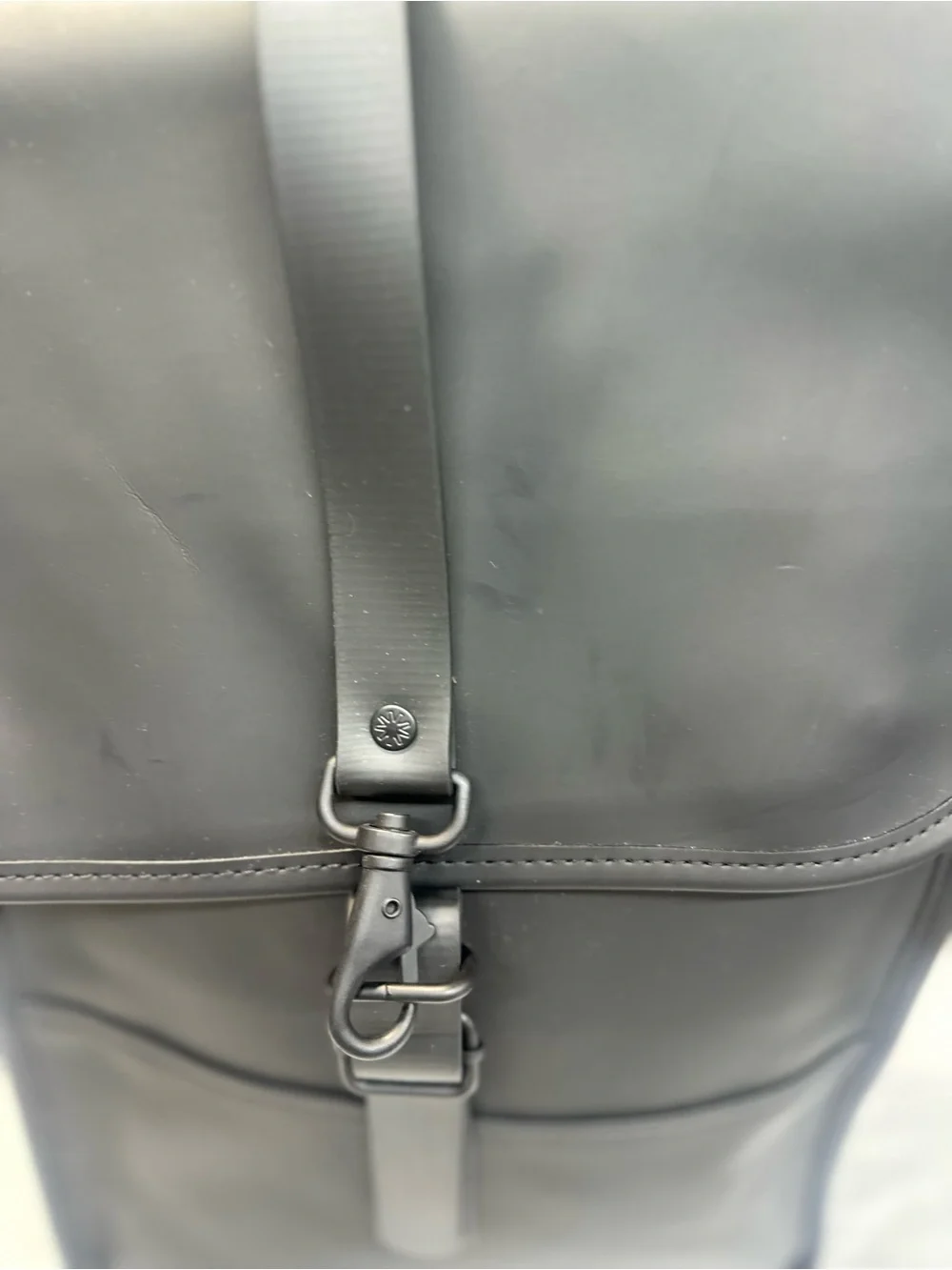 Rains  Backpack is clean and ever-contemporary. Like new no tag